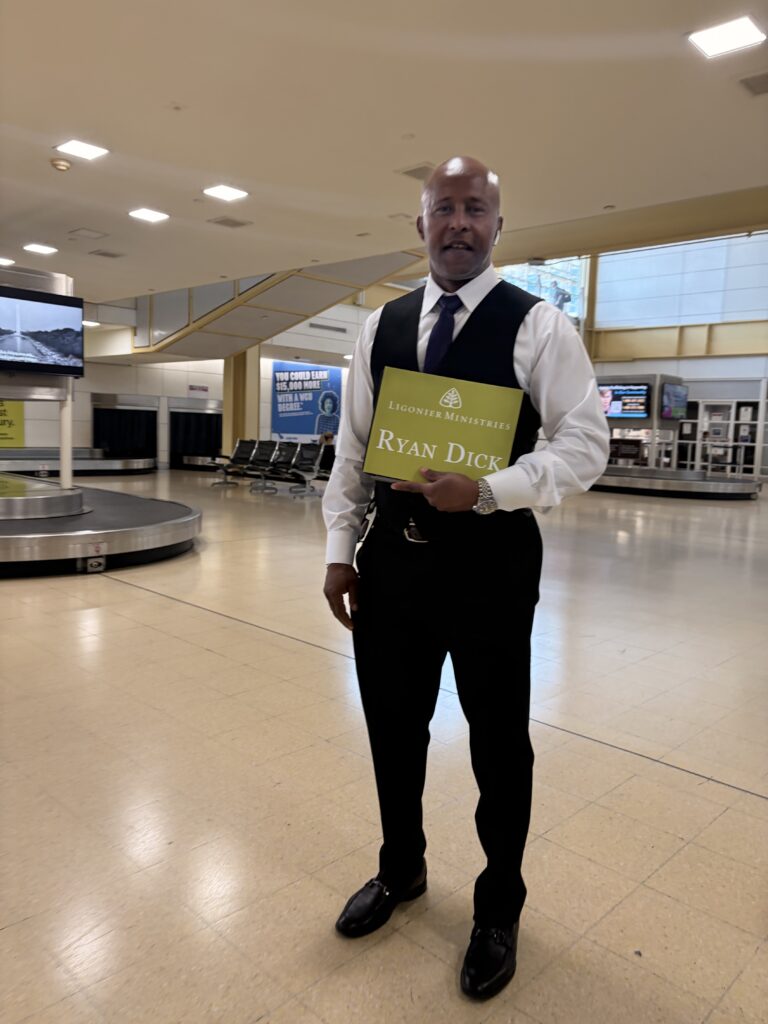 Airport meet-and-greet with a name sign