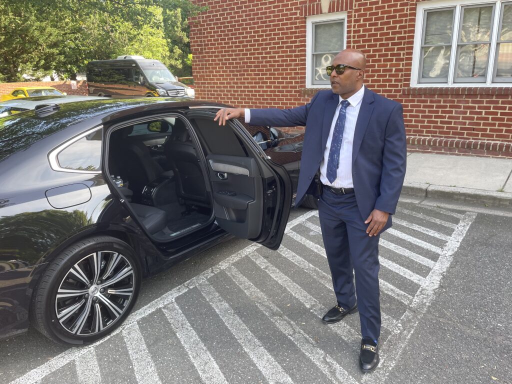 Chauffeur ready at the curb