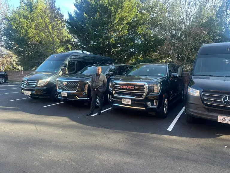 A line of black executive SUVs ready for a motorcade